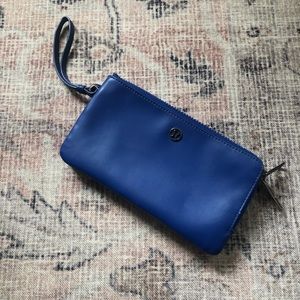 Bright blue lulu lemon wallet with wrist strap